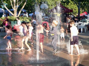 Children-play-in-the-fountain-on-a-hot-summer-evening-Davis-California-Wikipedia-300x225
