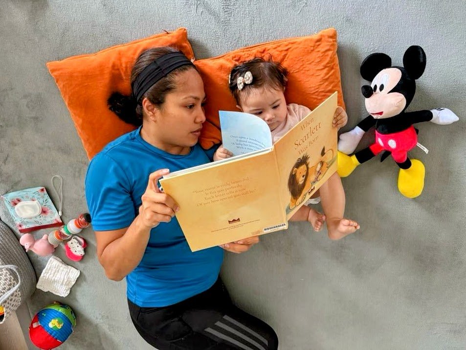 Scarlett,%208%20months%20old,%20reading%20with%20Mom%20%28ChildUp.com%29