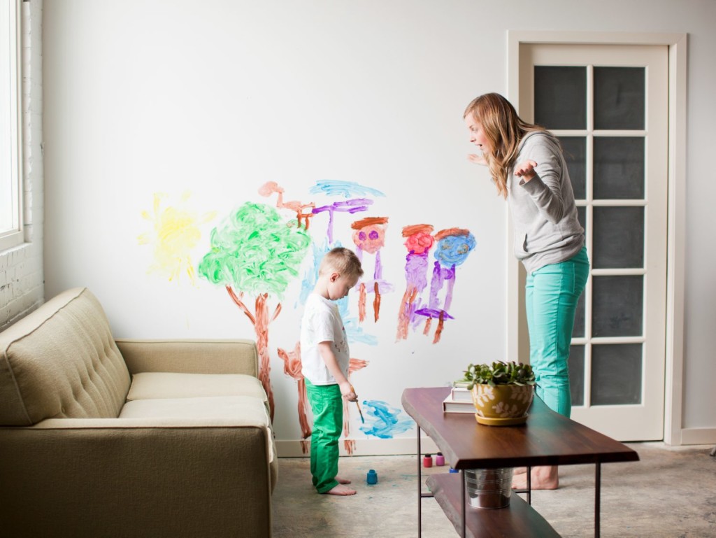 USA, Utah, Salt Lake City, Mother telling toddler boy (2-3) off for painting on walls